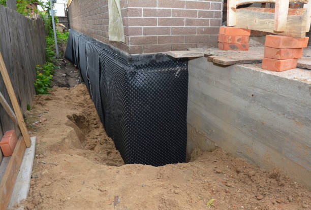 SJ Waterproofing Pros technician performing targeted Waterproofing assessment in Jonesboro, GA